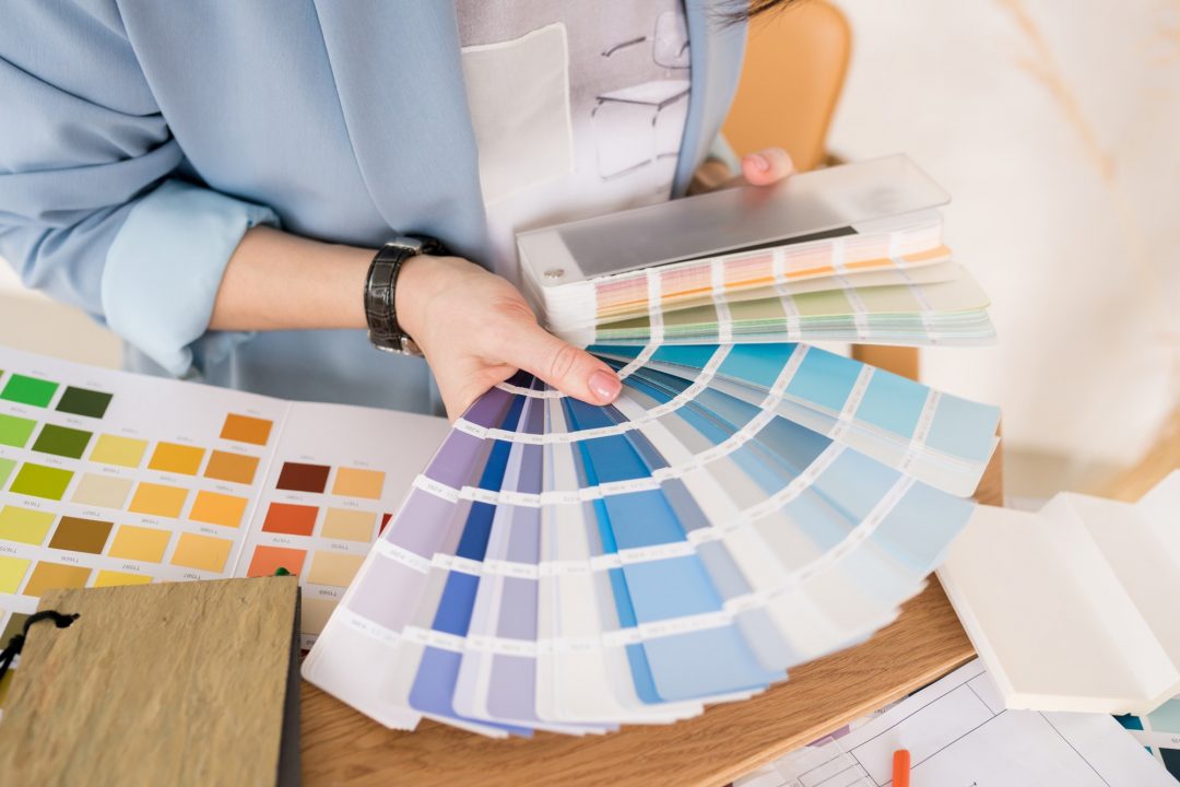 close-up-of-architect-woman-choosing-samples-of-wall-paint-